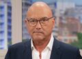 A close up of Gregg Wallace in a suit and wearing glasses with a serious expression
