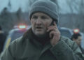 Frank Remnick holding a cell phone to his ear on The Last Frontier