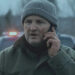 Frank Remnick holding a cell phone to his ear on The Last Frontier