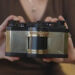 someones hands hold the wideluxx prototype in front of their body