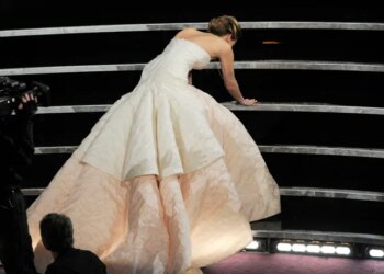 This Feb. 24, 2013, photo shows Jennifer Lawrence stumbling as she walks to the stage to accept the award for best actress in a leading role for "Silver Linings Playbook" during the Oscars at the Dolby Theatre in Los Angeles. (Photo by Chris Pizzello/Invision/AP, File)