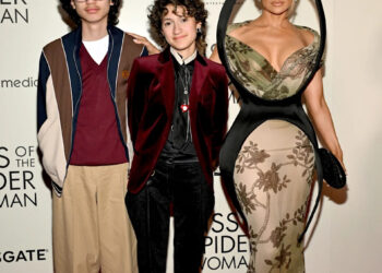 Jennifer Lopez, right, poses with kids Max, right, and Emme, center, on the "Kiss of the Spider Woman" red carpet in New York on Oct. 6.