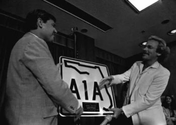 Florida Gov. Bob Graham presenting an A1A sign to Jimmy Buffett, circa 1980.
