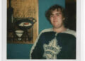 A photo of a young John Candy wearing a Toronto jersey.