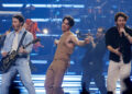 The Jonas Brothers -- Kevin (left to right), Joe and Nick -- perform in 2023 at the Prudential Center in Newark.