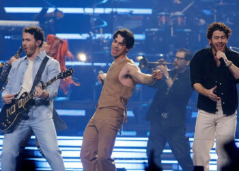 The Jonas Brothers -- Kevin (left to right), Joe and Nick -- perform in 2023 at the Prudential Center in Newark.