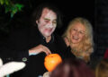 Ross and his wife, Jane Goldman, outside their home handing out treats to trick-or-treaters (PA Wire)