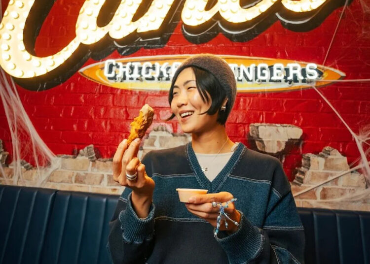 May Hong during a surprise “shift” at Raising Cane’s Times Square Global Flagship