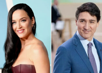 Katy Perry in a maroon dress and Justin Trudeau in a suit
