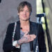 keith urban on stage with his hand over his heart