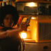 Keke Palmer as Alice aiming a pistol in Alice