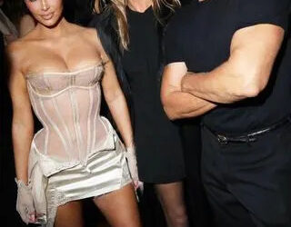 SEVENTY ONE Gin Kardashian rocked a sheer corset alongside a matching satin skirt, sheer white gloves and strappy heels.
