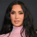 Kim Kardashian walks red carpet wearing pink dress