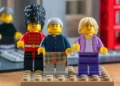 PA Media Lego minifigures of King Charles III and Queen Camilla, with a Scots Guard, outside a scale Lego model of the Albert Hall in Ballater, which were built by Nicola Reid from Ballater Lego Club to mark the royal visit.