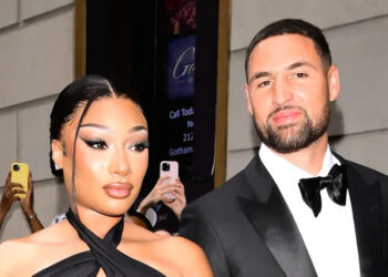Megan Thee Stallion and Klay Thompson pose for photo together.