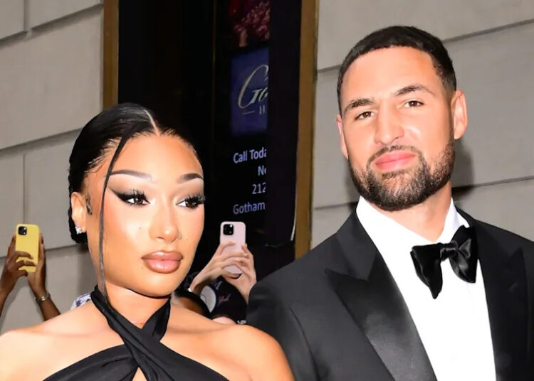 Megan Thee Stallion and Klay Thompson pose for photo together.