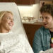 Katherine Heigl and Seth Rogen smiling in Knocked Up.