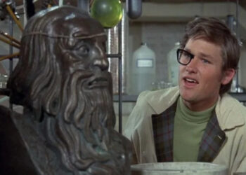 Dexter Riley with half-invisble glasses and a bust of an ancient man in Now You See Him, Now You Don't