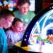 Children playing at an arcade inside Launch Entertainment.