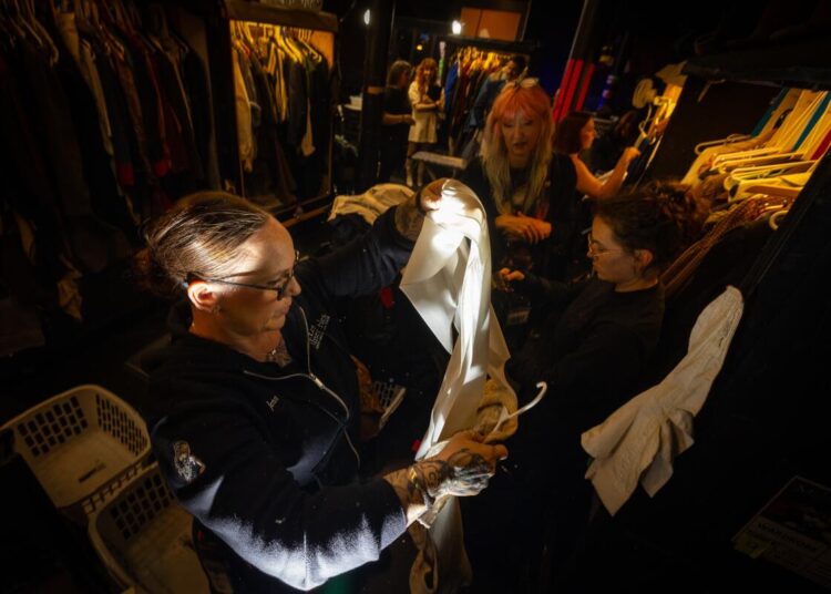 Jennifer Thoele and other wardrobe staff prepare costumes.