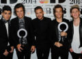 Zayn Malik, Harry Styles, Liam Payne, Louis Tomlinson and Niall Horan of One Direction, winners of the British Video and Global Success BRIT awards, pose in the winners' room at The BRIT Awards 2014 at 02 Arena on February 19, 2014 in London, England.