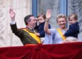Luxembourg's Grand Duke Guillaume and Grand Duchess Stephanie hold their children, Prince Charles and Prince Francois, as they wave from the balcony of the Grand Ducal Palace in Luxembourg on Friday.