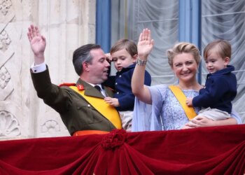 Luxembourg's Grand Duke Guillaume and Grand Duchess Stephanie hold their children, Prince Charles and Prince Francois, as they wave from the balcony of the Grand Ducal Palace in Luxembourg on Friday.