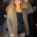 Mariah Carey poses in black shorts with plaid blazer as arriving at Watch What Happens Live With Andy Cohen in New York City