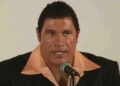 Mark Kerr (Dwayne "The Rock" Johnson) addresses the press in The Smashing Machine.