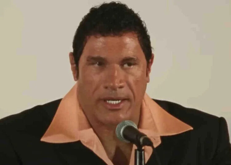 Mark Kerr (Dwayne "The Rock" Johnson) addresses the press in The Smashing Machine.