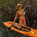 Brie Larson paddleboarding in a bikini