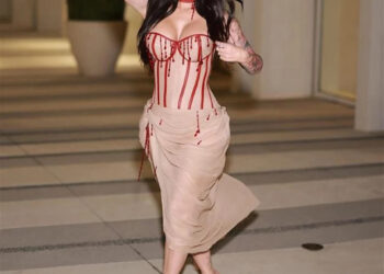 a person walking in a stylish outfit with a blended color scheme