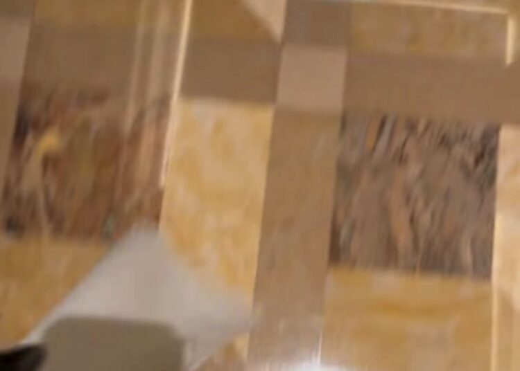 floor design in a luxurious setting with feet partially visible
