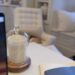 Ahead of the launch on Tuesday afternoon, the Duchess of Sussex, 44, shared a clip of her working at her laptop and perched on her desk was one of her new $64 candles and a blue notebook with her royal cypher embossed in gold on the cover (pictured right)