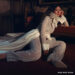 Mia Goth wears a white lace outfit in a shoot for Who What Wear.