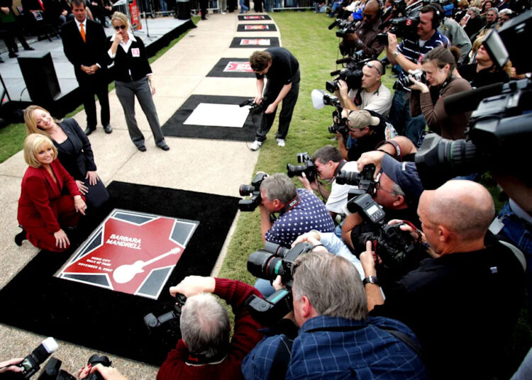 Barbara Mandrell, left, with daughter Jaime Dudney, poses in front of her star during the Music City Walk of Fame Induction ceremony near the Country Music Hall of Fame on Nov. 5, 2007.