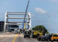 A scene for the ABC show Nashville 911 involving an Airstream trailer stuck on the top of a bridge due to a tornado is filmed on the Korean Veterans Bridge Sunday, July 13, 2025