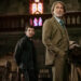 Benoit Blanc looks up inside a church in Wake Up Dead Man: A Knives Out Mystery