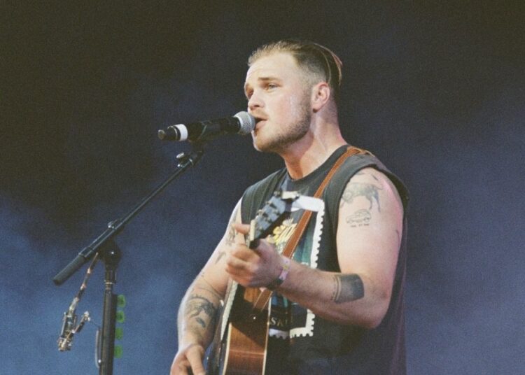 New Zach Bryan Song Sparks Backlash Over ICE Raids And Patriotism