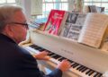 Dan Truhitte plays "Edelweiss" from "The Sound of Music" in his home. (Spectrum News 1/Courtney Davis)
