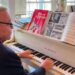 Dan Truhitte plays "Edelweiss" from "The Sound of Music" in his home. (Spectrum News 1/Courtney Davis)