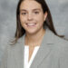 Headshot of Nyla Lewis wearing a gray suit