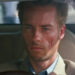 Guy Pearce as Leonard driving a car in Memento