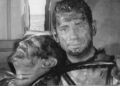 Yves Montand as Mario drives a mortally wounded Charles Vanel as Jo in The Wages of Fear
