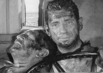 Yves Montand as Mario drives a mortally wounded Charles Vanel as Jo in The Wages of Fear