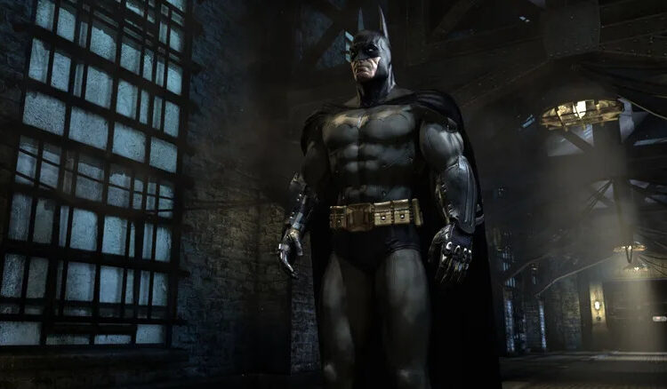 Batman standing in the halls of Arkham Asylum in Batman: Arkham Asylum