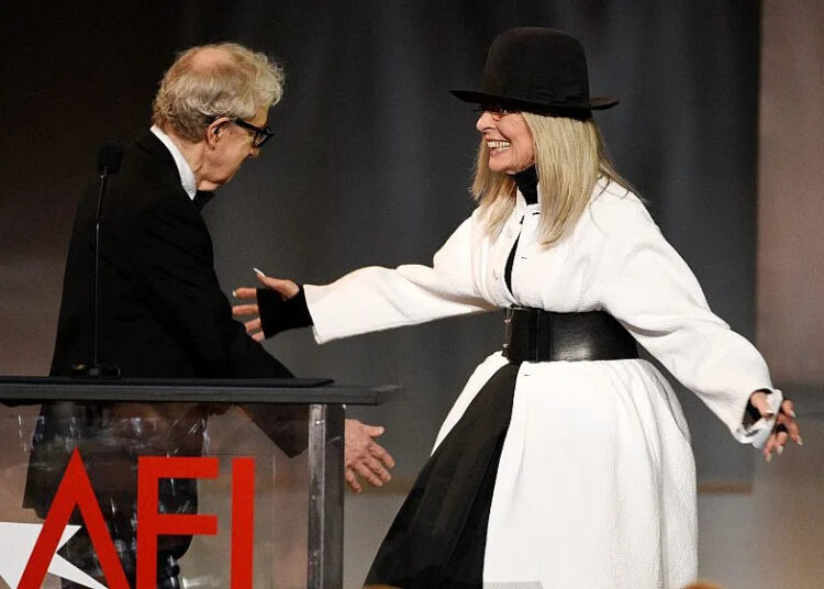 FILE - Filmmaker Woody Allen, left, greets actress Diane Keaton onstage to present her with the 45th AFI Life Achievement Award on June 8, 2017, in Los Angeles. (Photo by Chri