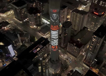 Sky Tower in Auckland with a projection of Ozzy Osbourne.