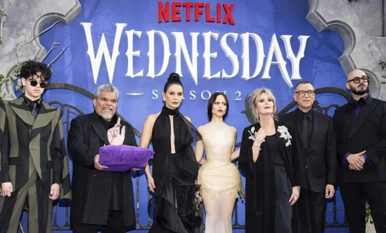 Isaac Ordonez, Luis Guzman, Catherine Zeta-Jones, Jenna Ortega, Joanna Lumley, Fred Armisen and Victor Dorobantu pose at the premiere of 'Wednesday' in July 2025 in LA.