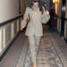 Paige DeSorbo gets ready for the Victoria Beckham Spring 2026 show during Paris Fashion Week wearing a gray suit set